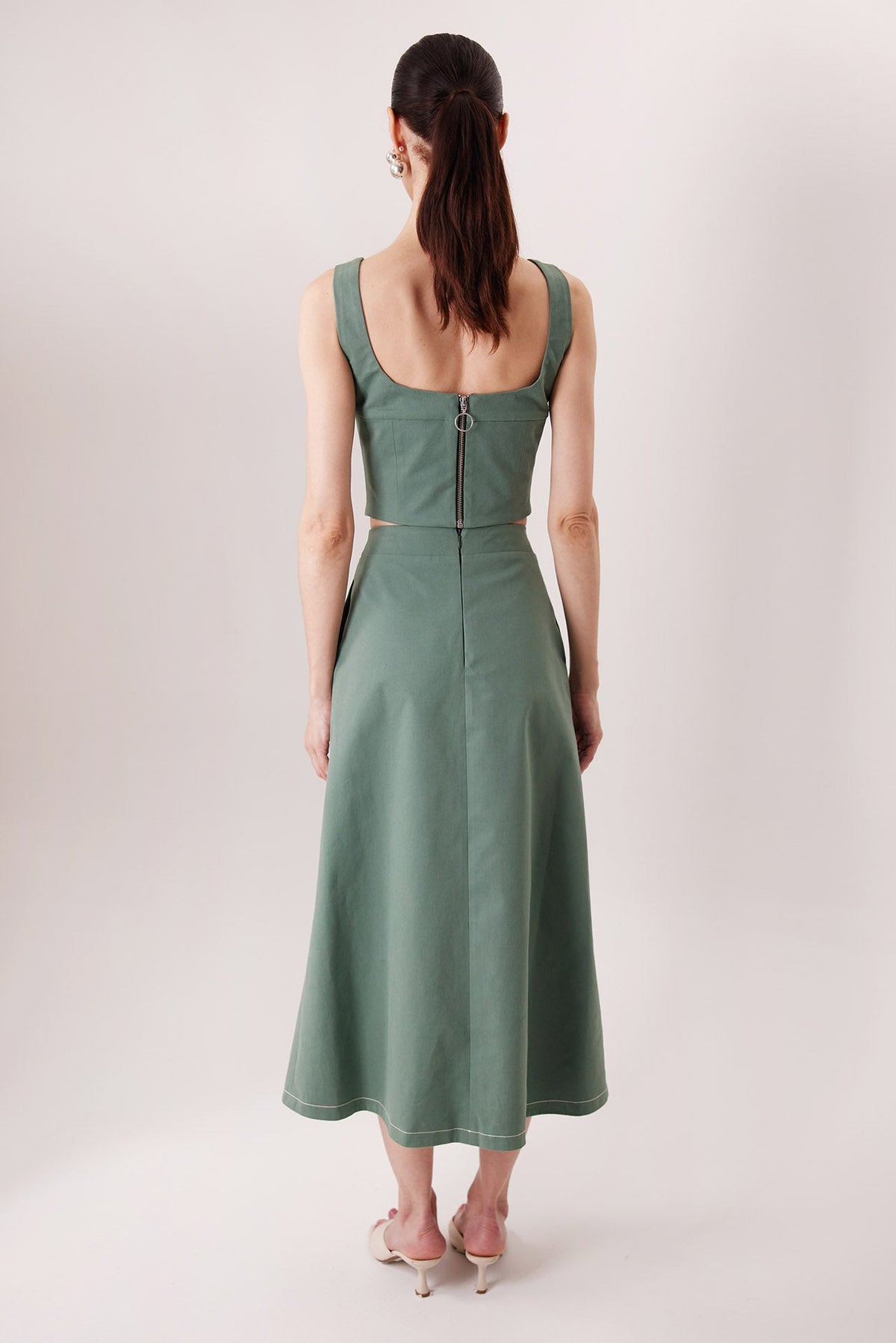 The Izza Midi Skirt in matcha green, back view — Sanna, The Gentlewoman collection