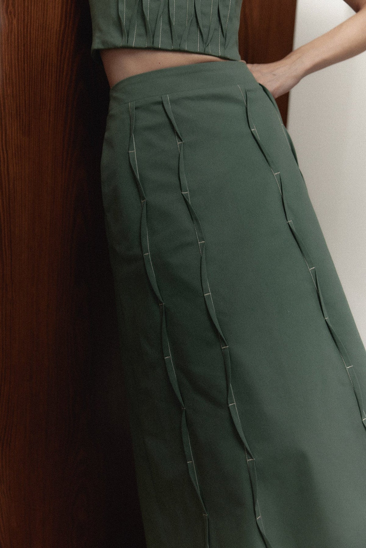 The Izza Midi Skirt, contrast topstitched pleats detail — Sanna, The Gentlewoman campaign