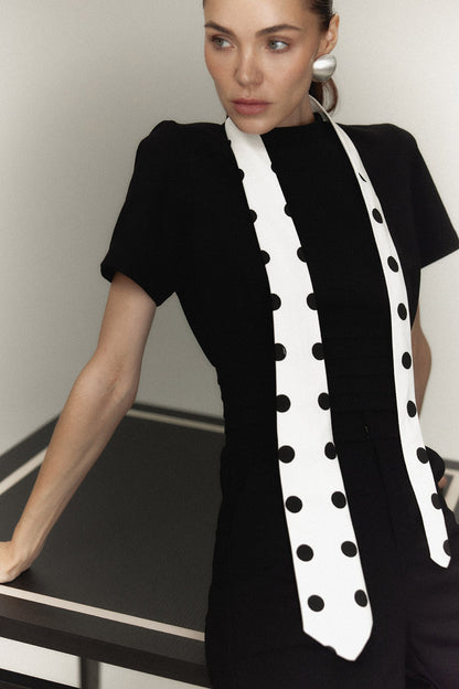 The Polly Top in black with a polka dot tie — Sanna, The Gentlewoman campaign