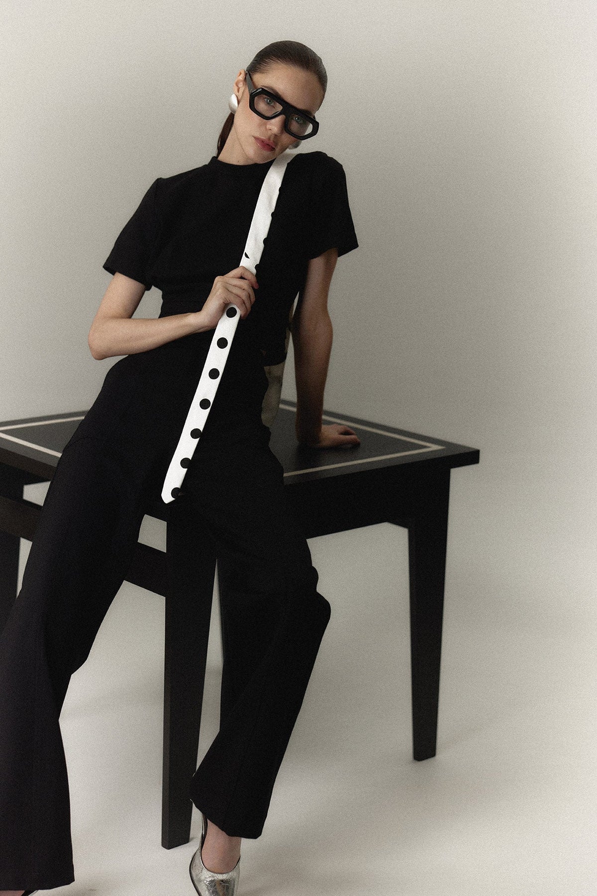 The Polly Top in black with a polka dot tie — Sanna, The Gentlewoman campaign