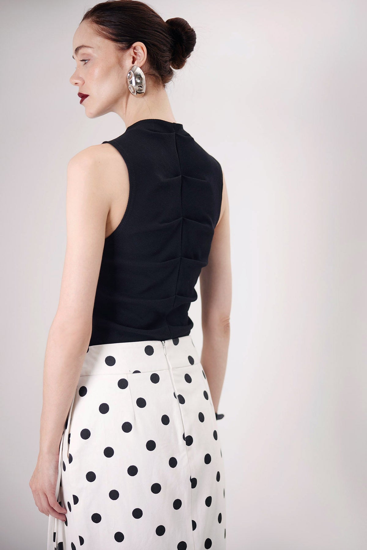 The Consani Top in black, back view — Sanna, The Gentlewoman collection